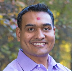 Dr. Patel smiling outside